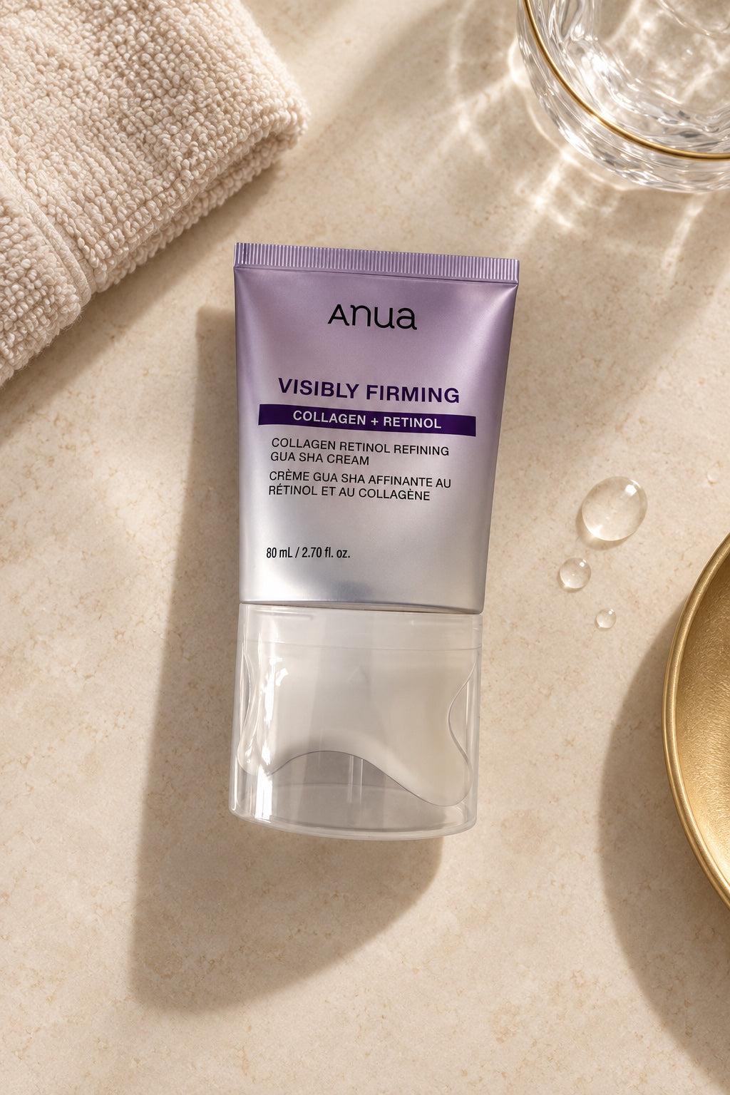 Crème Anua Collagen Retinol Gua Sha, vue à plat sur fond beige